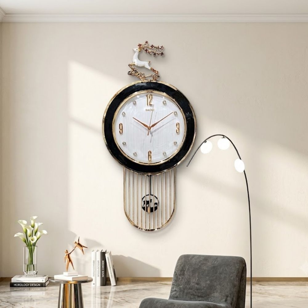 Elegant round wall clock featuring a rich wooden outer ring, textured Black dial with crystal hour markers, topped with a golden leaping stag crest and a wire cage pendulum underneath.