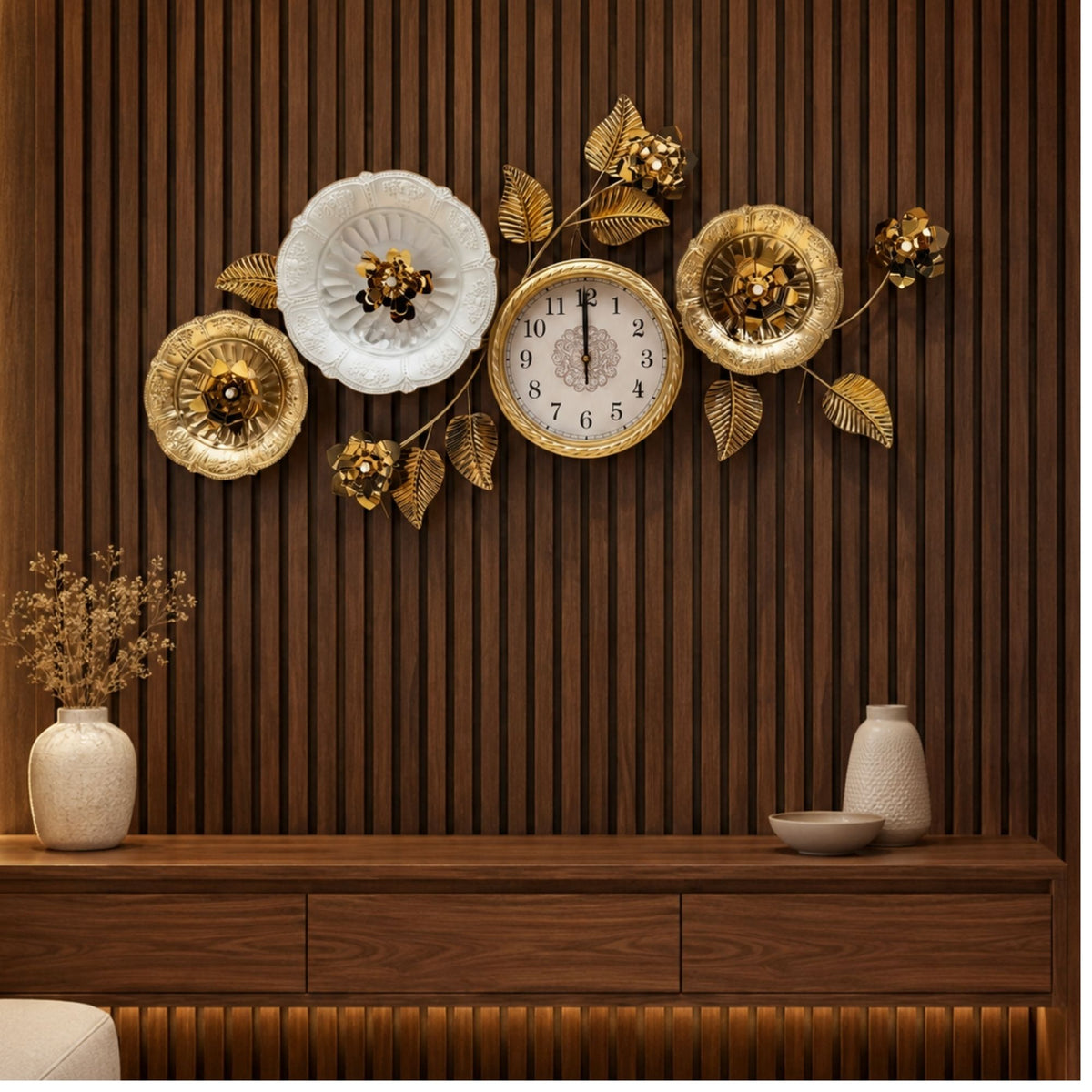 Wide metal wall clock with round dial, surrounded by decorative gold and white flowers with leaves.