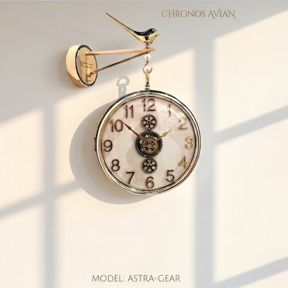 Double-sided hanging station wall clock with an Black white dial, golden numbers, and moving central gears, suspended from a decorative bird-motif bracket in a modern living space.