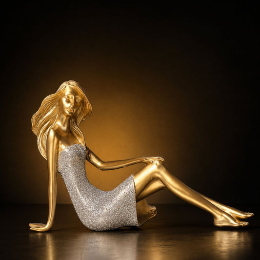 Golden reclining lady showpiece statue with silver glitter dress