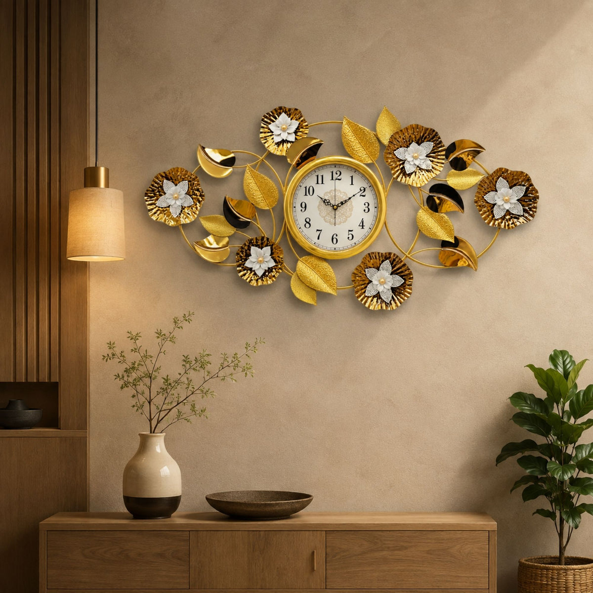Horizontal metal wall clock featuring central round dial surrounded by gold fluted flowers, white blooms, and metallic leaves.