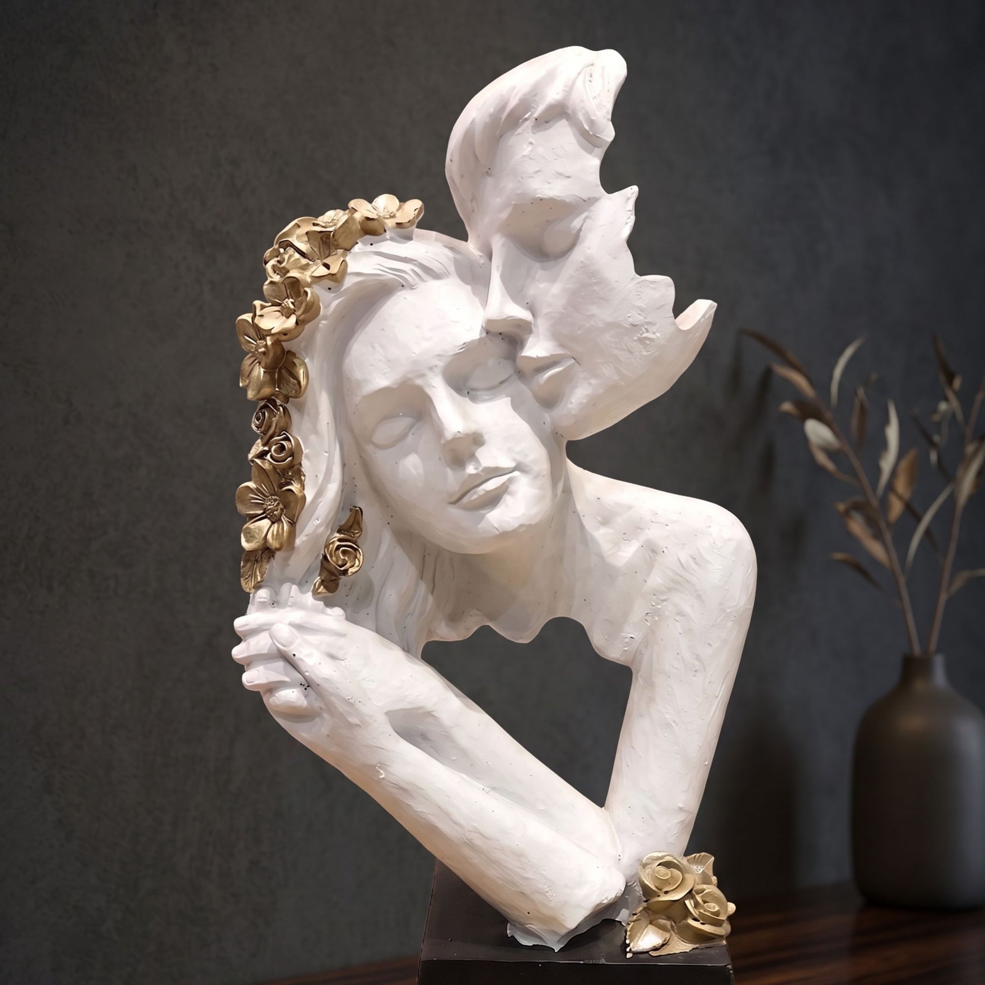 Matte white abstract resin sculpture of a romantic couple with golden rose highlights for modern table decor.