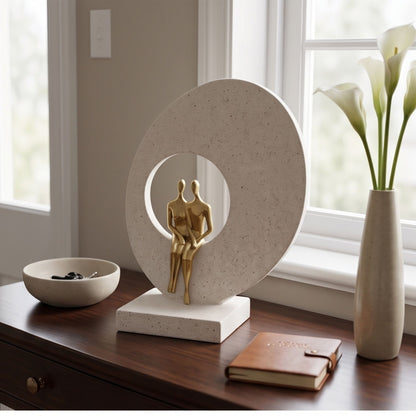 Modern abstract golden couple figurine standing in front of a large circular arch on a textured white base decorative showpiece-1