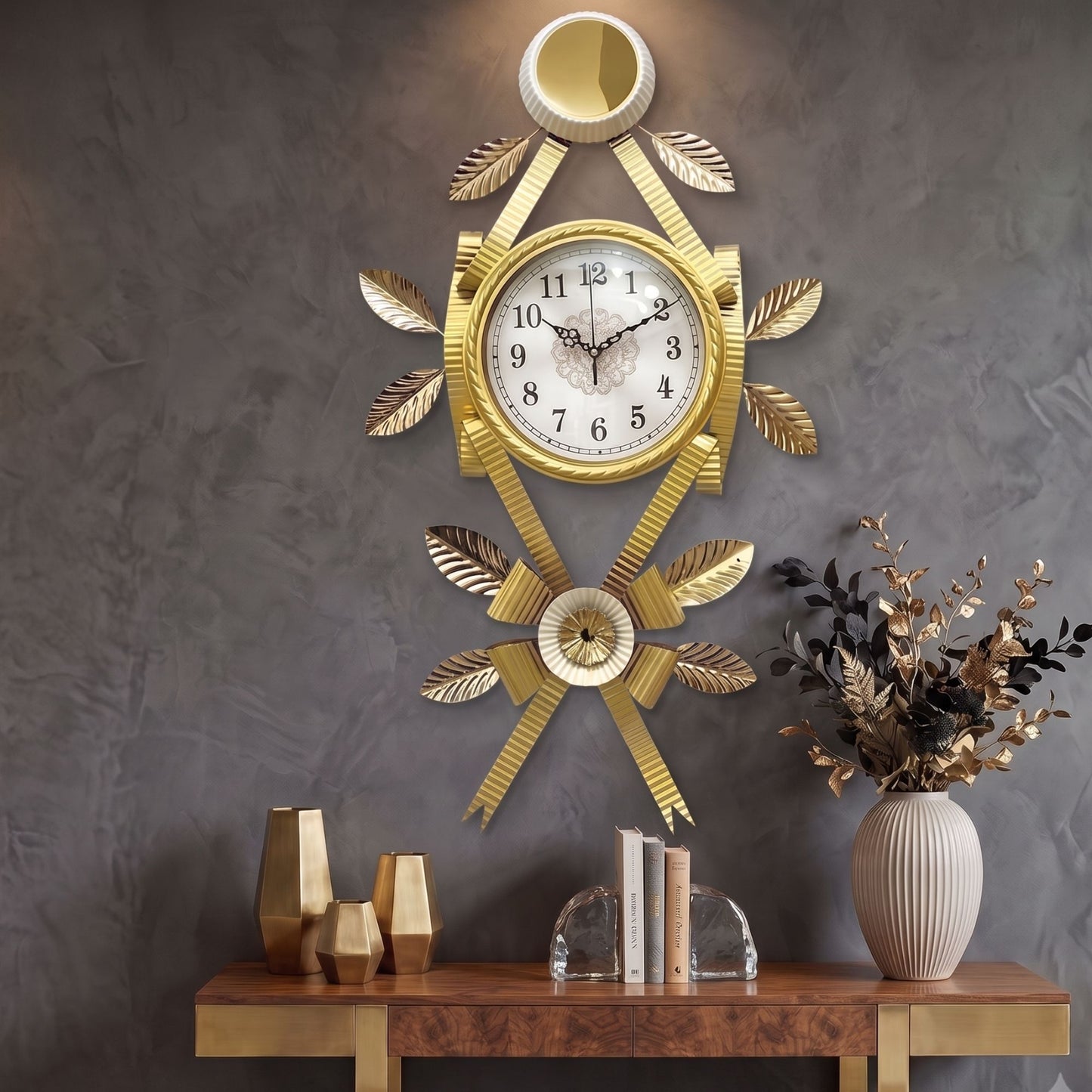 Ornamental gold metal wall clock with leaf accents, textured ribbons, and a round dial with Arabic numerals.