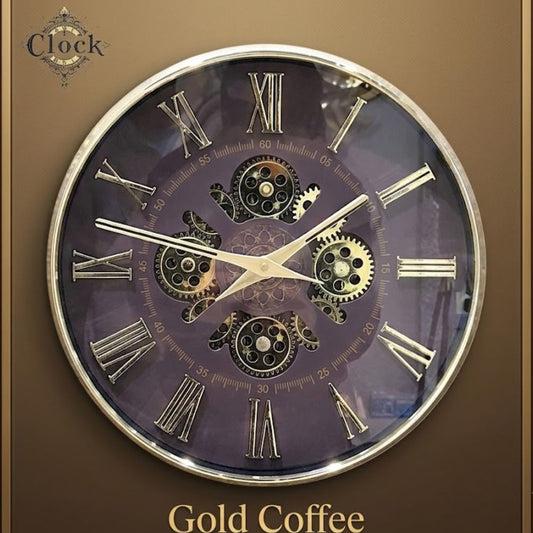Round wall clock with a coffee brown dial, silver-gold Roman numerals, and visible central gears inside a silver rim.