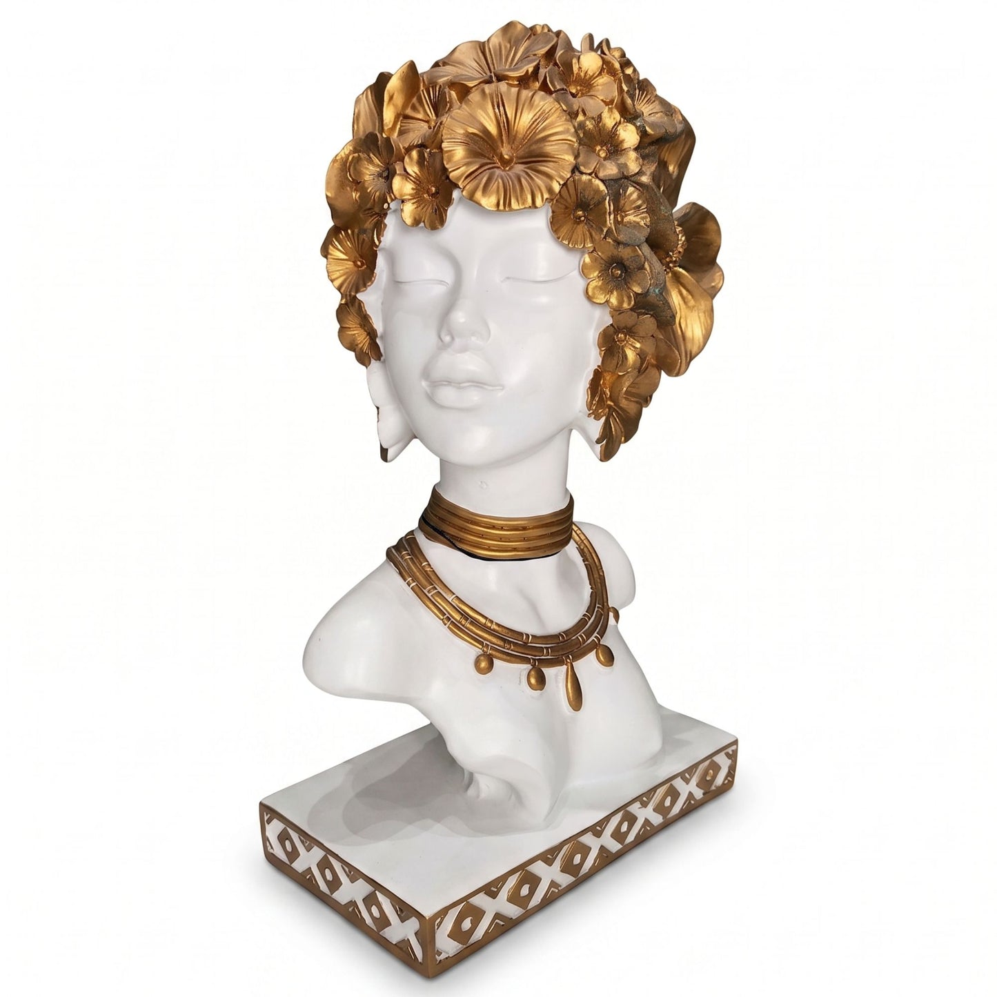 White resin bust sculpture of a serene woman with golden floral hair and gold necklace on a decorated pedestal.