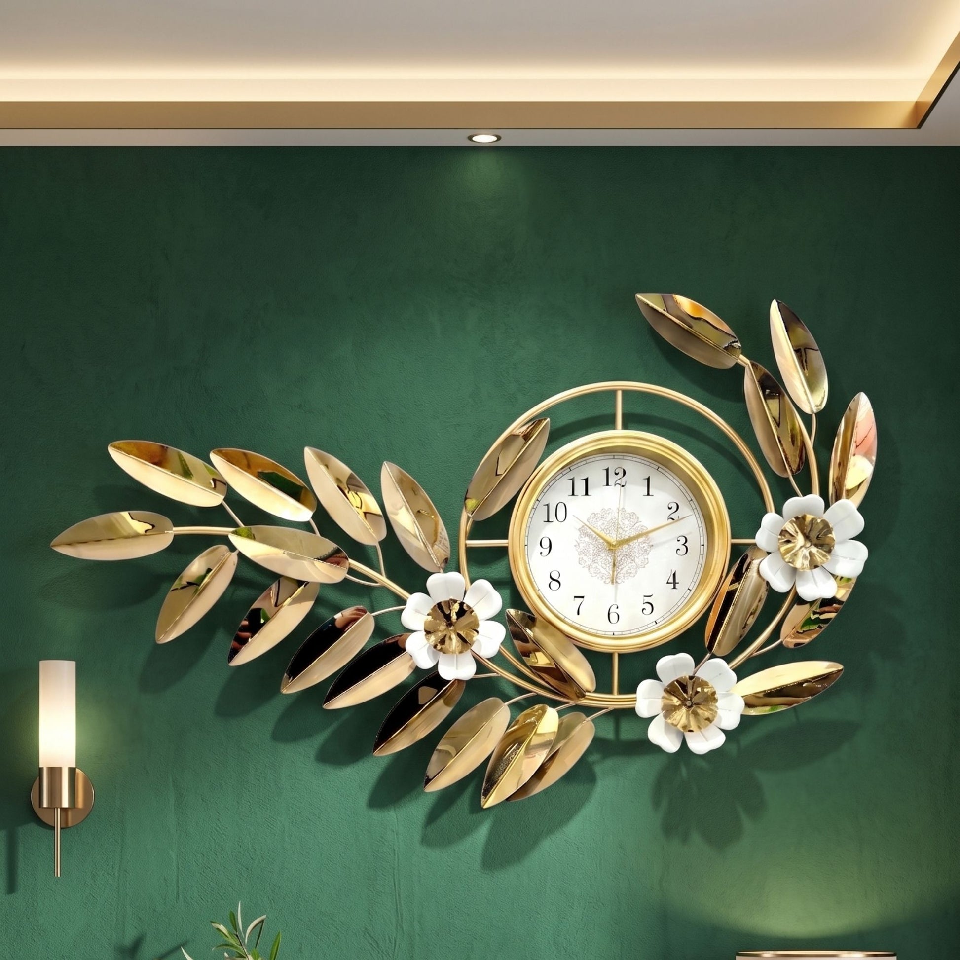 Wide decorative metal wall clock featuring metallic gold leaves, white flower accents, and a central round dial.